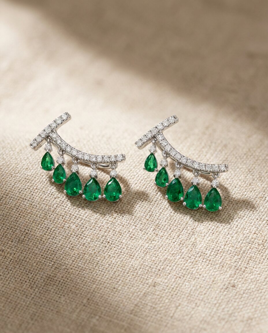 Custom emerald and diamond earrings built to spec