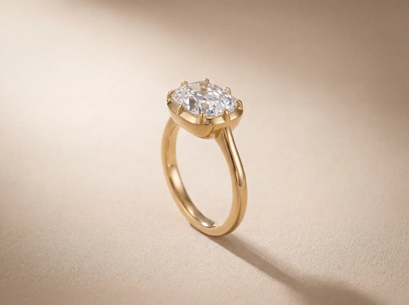 Old-mine cushion solitaire ring in 18K yellow gold