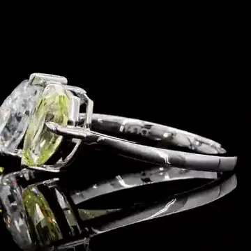 Toi et moi engagement ring with a yellow diamond