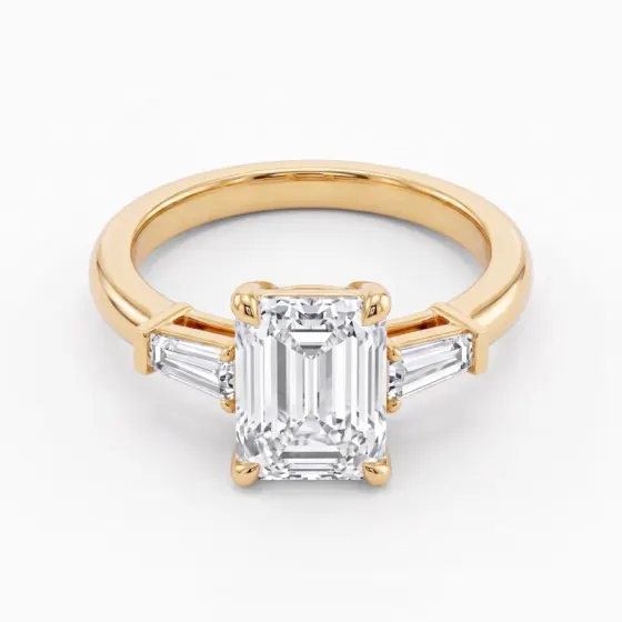 Emerald cut three-stone ring with tapered baguettes