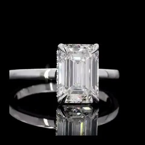 Engagement ring with emerald-cut center diamond
