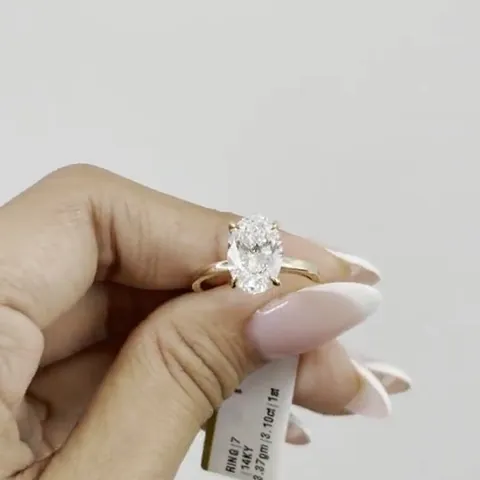 Certified natural oval diamond in a gold solitaire ring
