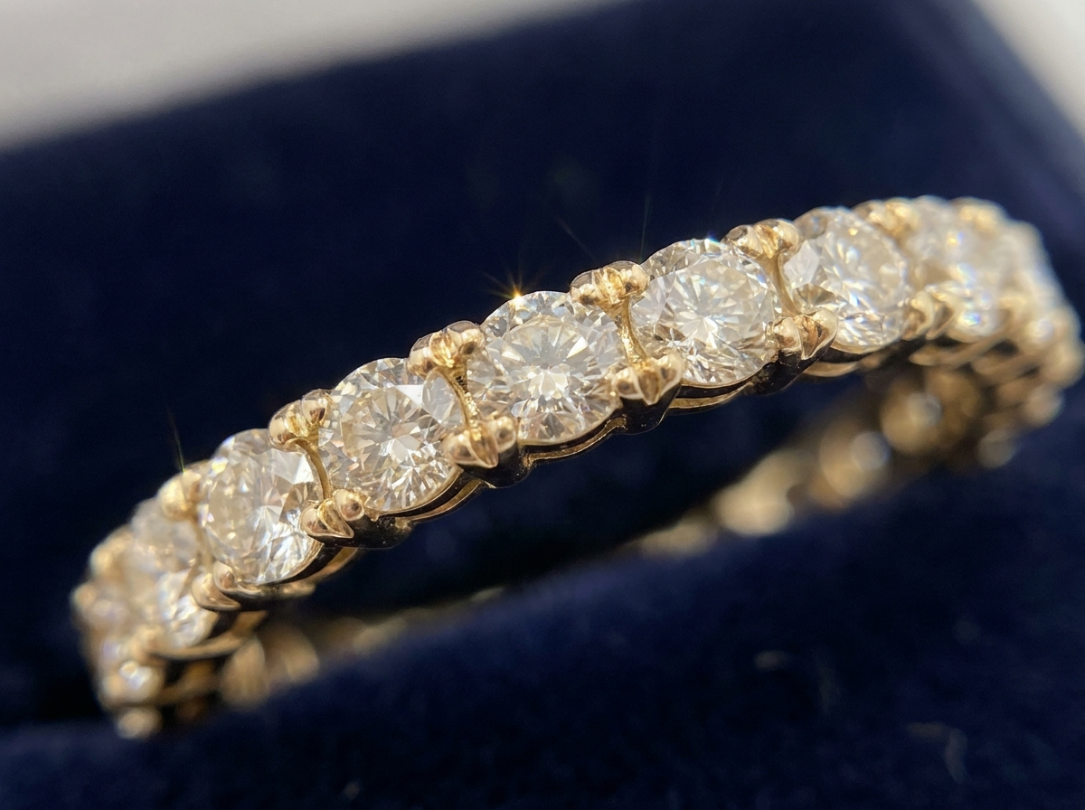 close up macro of natural melee diamonds matched for color size and clarity in a single eternity band row