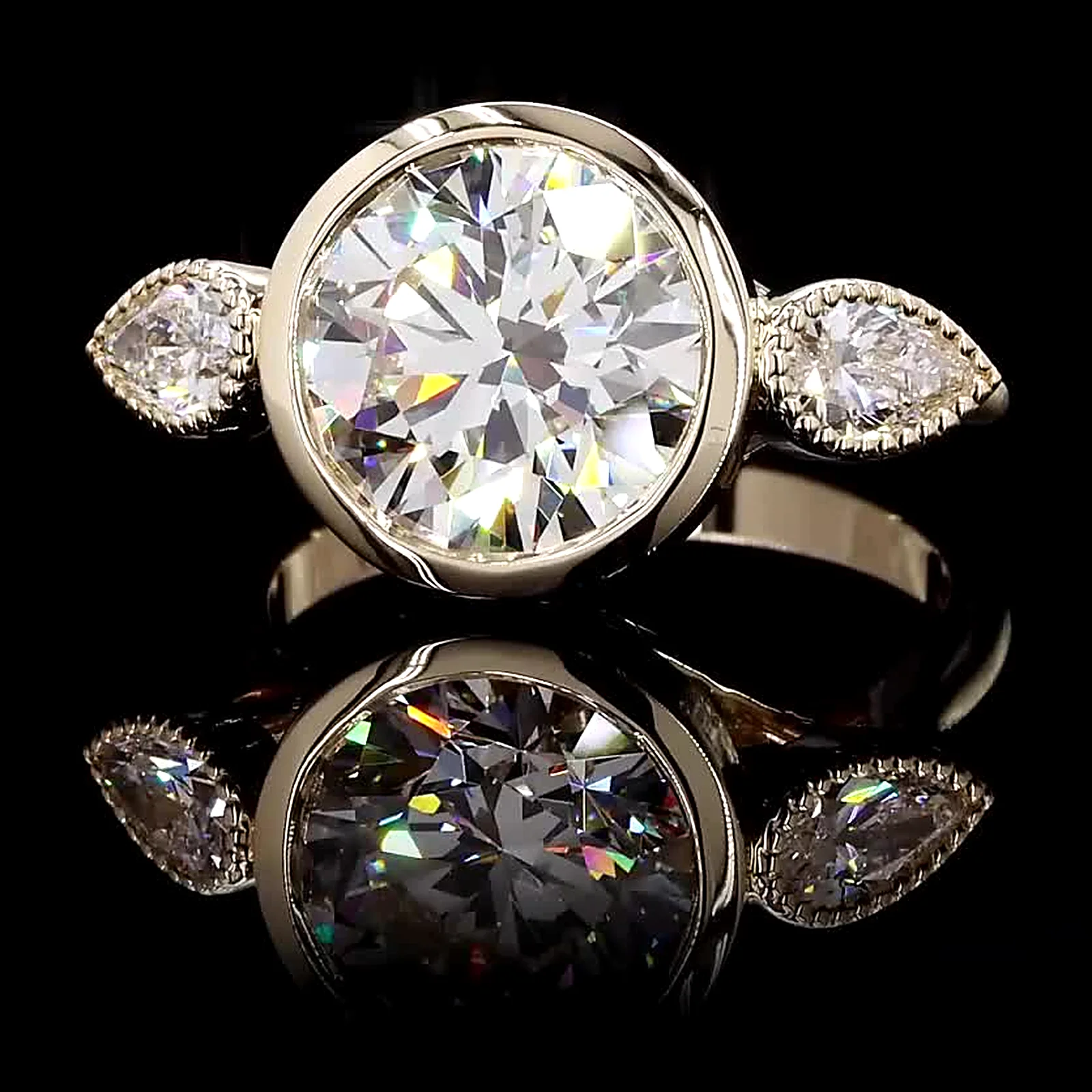 Bezel-set round diamond ring with marquise side diamonds, 14K yellow gold, 4.65 ct total