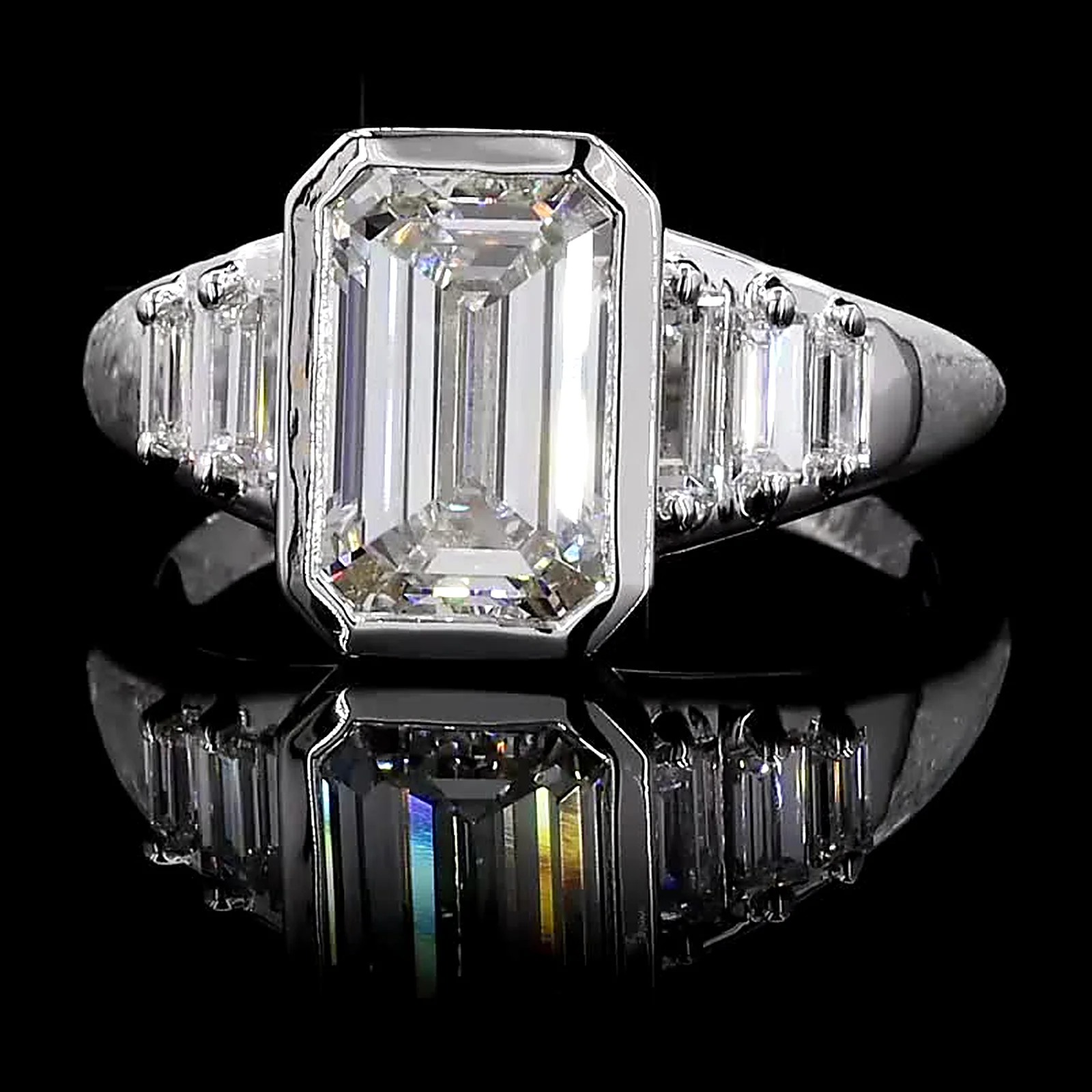Bezel-set emerald-cut diamond ring with step-cut side diamonds, 14K white gold, 3.64 ct total