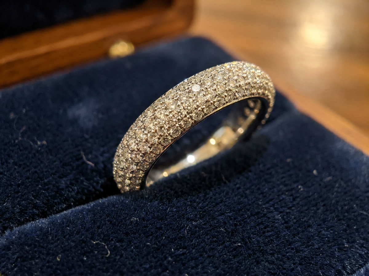 Finished pavé diamond eternity band covered edge to edge in sparkling natural melee diamonds